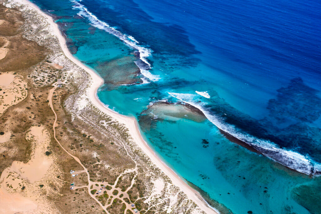Aerial view of Ningaloo Reef, one of our top five green travel destinations in Australia