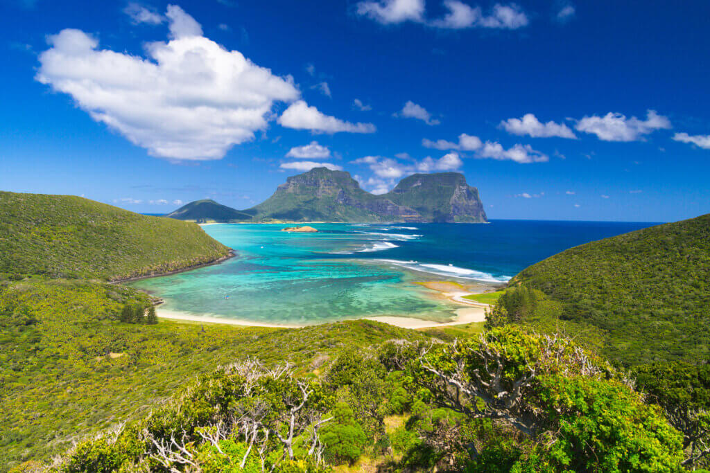 View south over lagoon to Mt Lidgbird and Gower, with heart-shaped cloud overhead. From Mt Eliza on Lord Howe Island, one of our top five green travel destinations in Australia